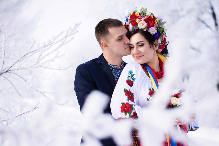  A man hugging one of the beautiful Ukraine women from behind.